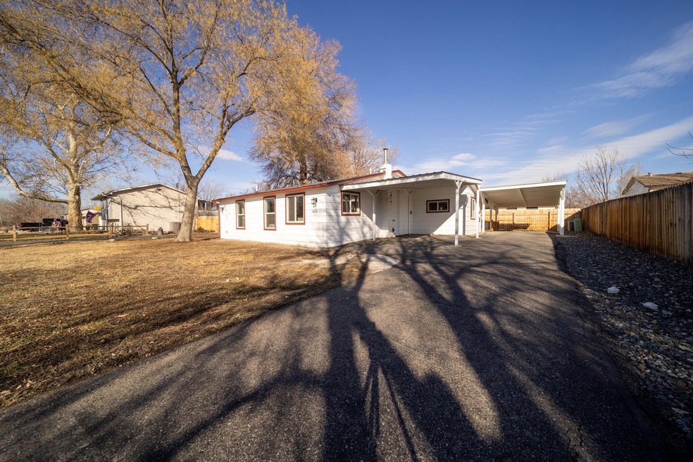 East driveway with carport