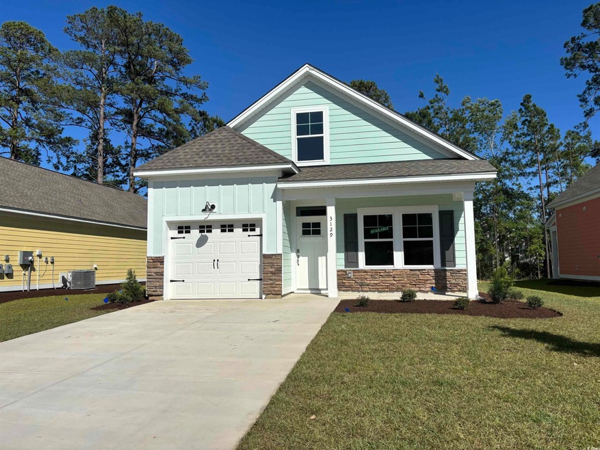Craftsman house featuring stone siding, an attached garage, a shingled roof, board and batten siding, and a front yard