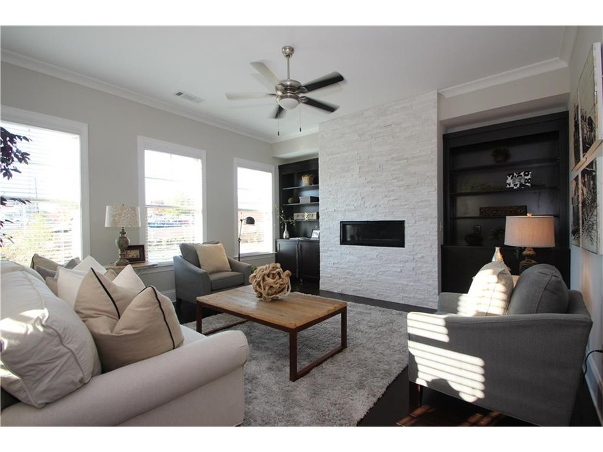 Family room w/ linear quartzite stone-front firepl