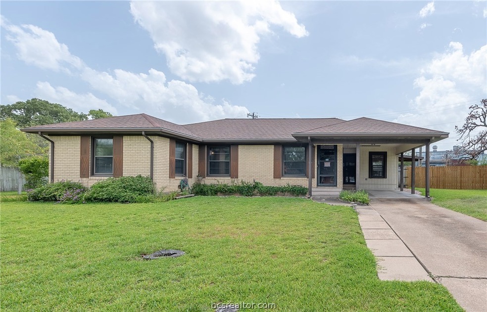 Front view with all brick exterior, gutters and sh