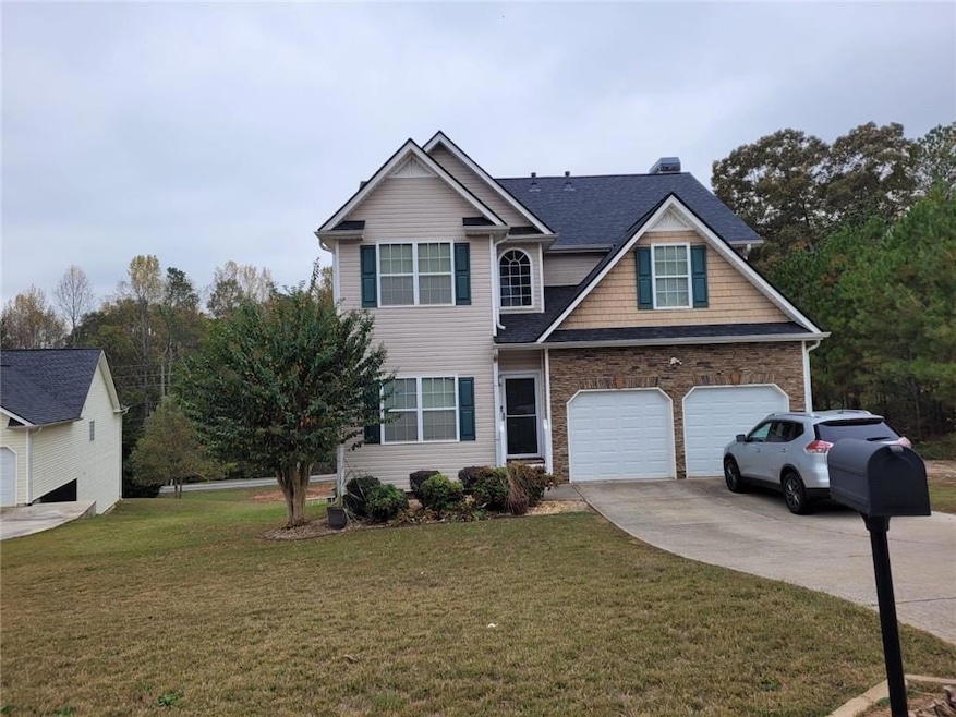 View of front of home featuring a garage and a fro