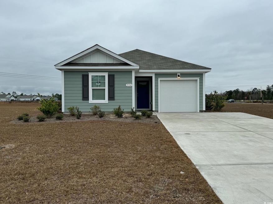 View of front facade featuring a garage
