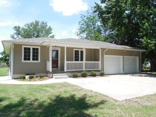 Inviting front porch and a fun spot to enjoy the q
