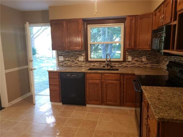 507 S Adams St, Raymore, MO 64083 - photo 1