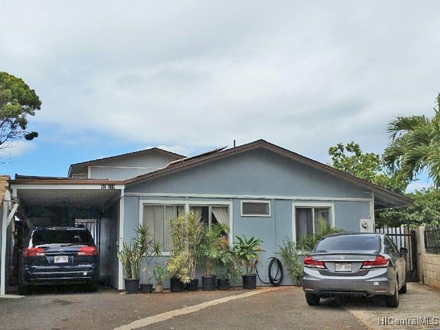 Front view of the house with lots of parking