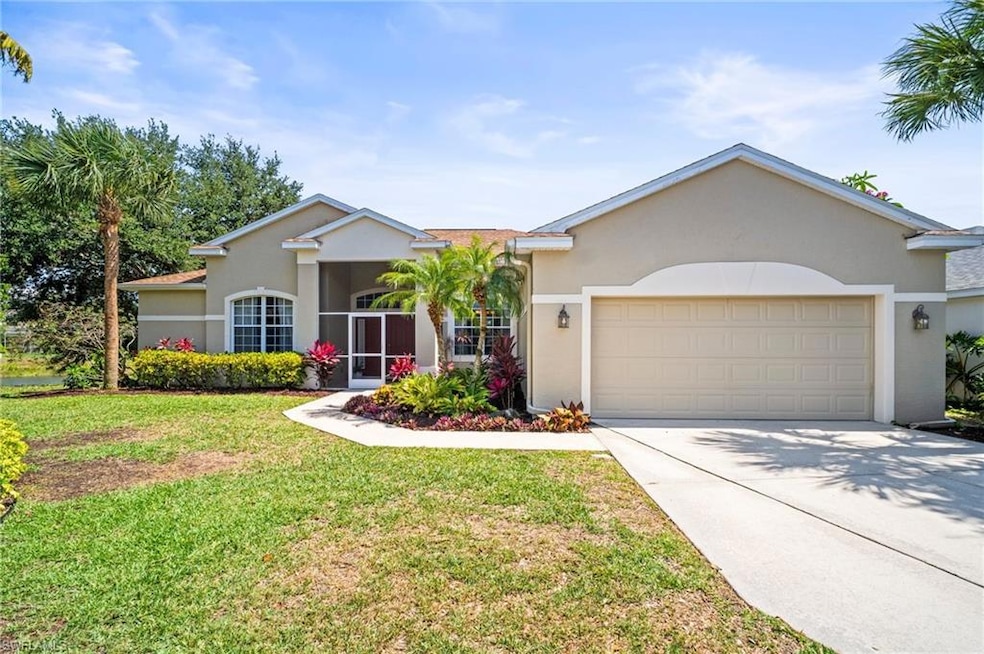 Single story home with stucco siding, driveway, a 