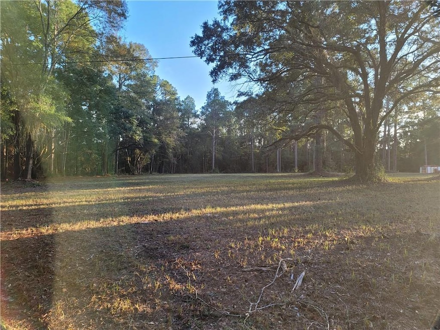 View of yard with a wooded view