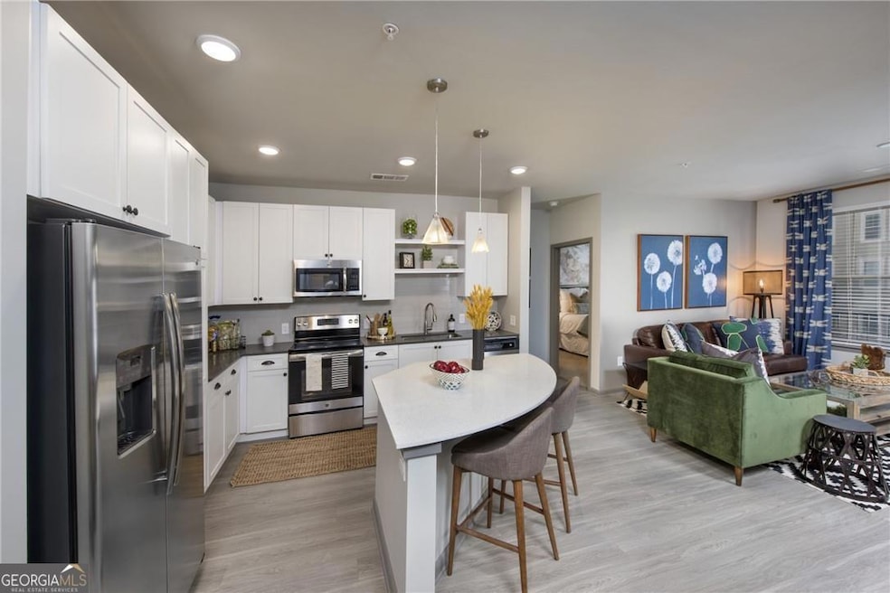 Kitchen featuring stainless steel appliances, sink