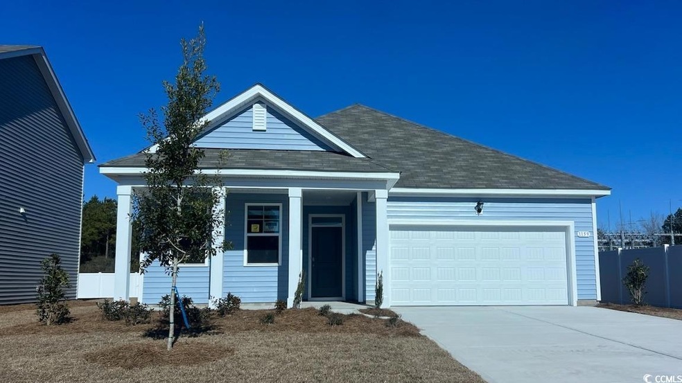 View of front of home featuring a garage