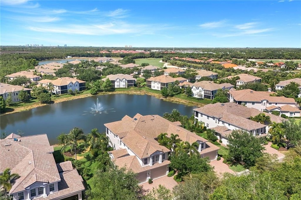 Aerial view with a water view and a residential view