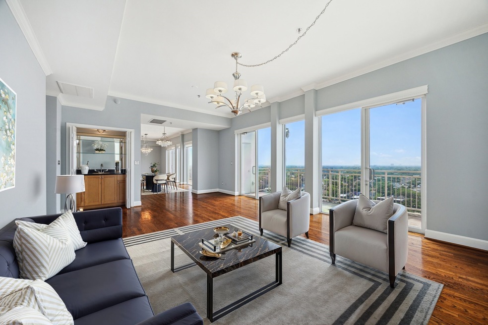 Spacious open living and dining area featuring bre