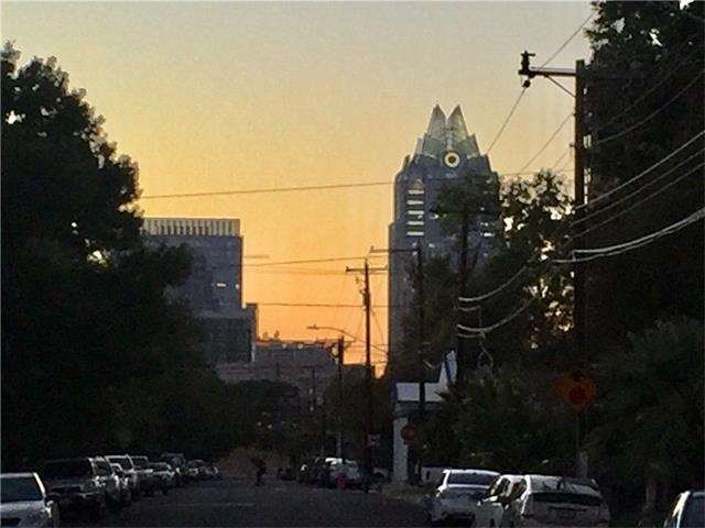 Downtown sunset view from in front of property. Po
