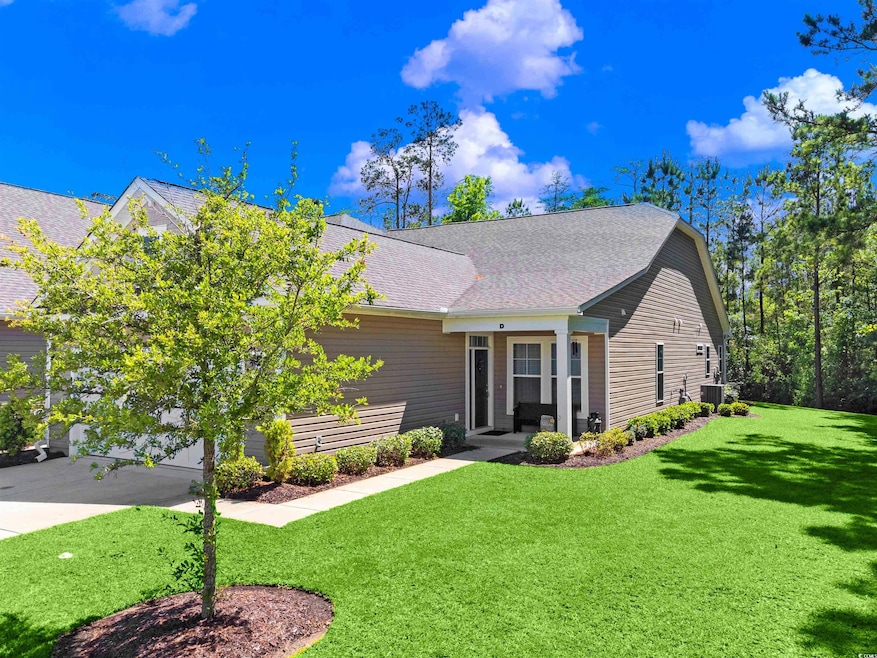 View of front of home featuring a front lawn, roof
