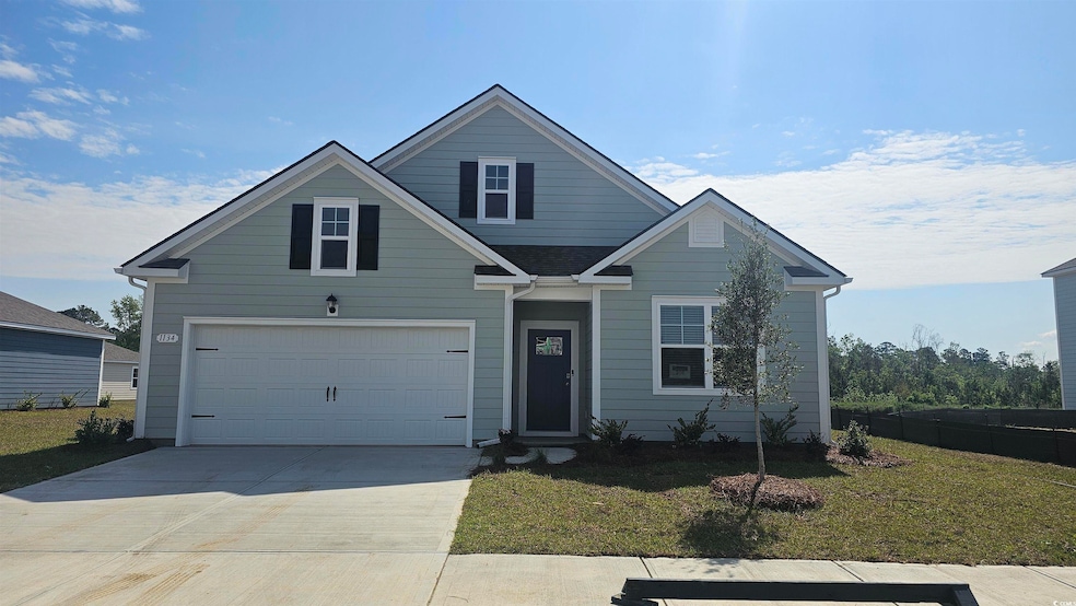 View of front of home featuring fence, a front yar