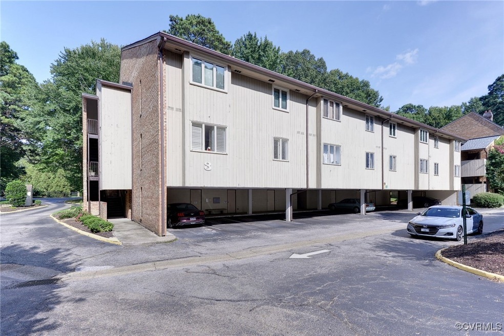View of building exterior with a carport