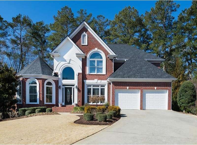 Professionally landscaped, 4-sided brick home, sit