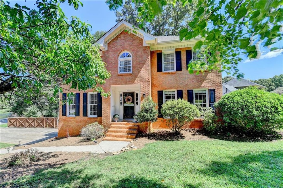 View of front of house with brick siding and a front yard