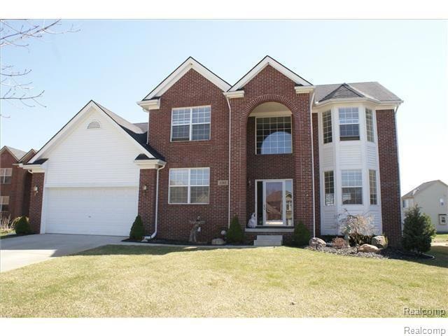 SUMMER VIEW OF FRONT ENTRANCE WITH COVERED PORCH,T