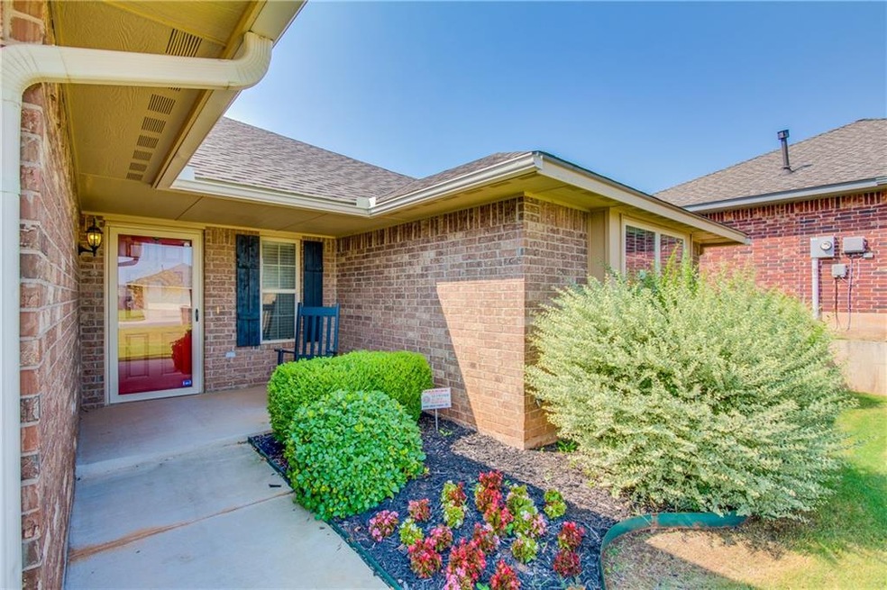 Front Porch w/ beautiful landscaping!