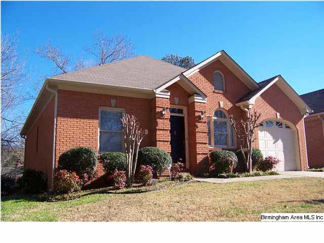This beautiful brick garden home sits on a corner 