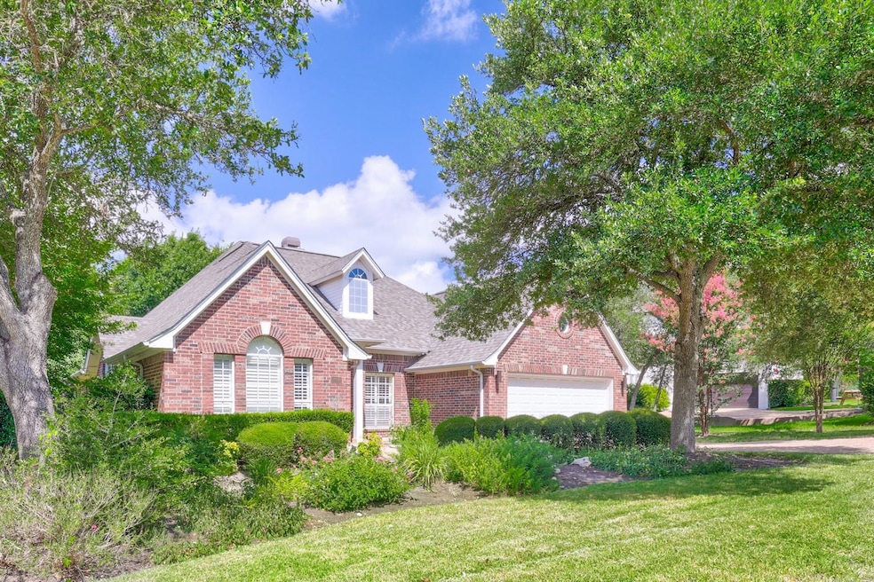 Traditional-style house featuring brick siding, a