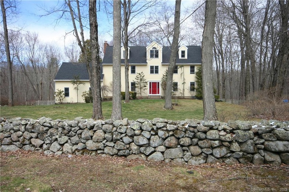 Quintessential Colonial with rambling stone walls!