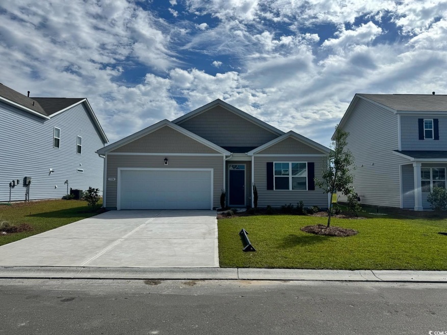 View of front of home featuring a garage and a fro