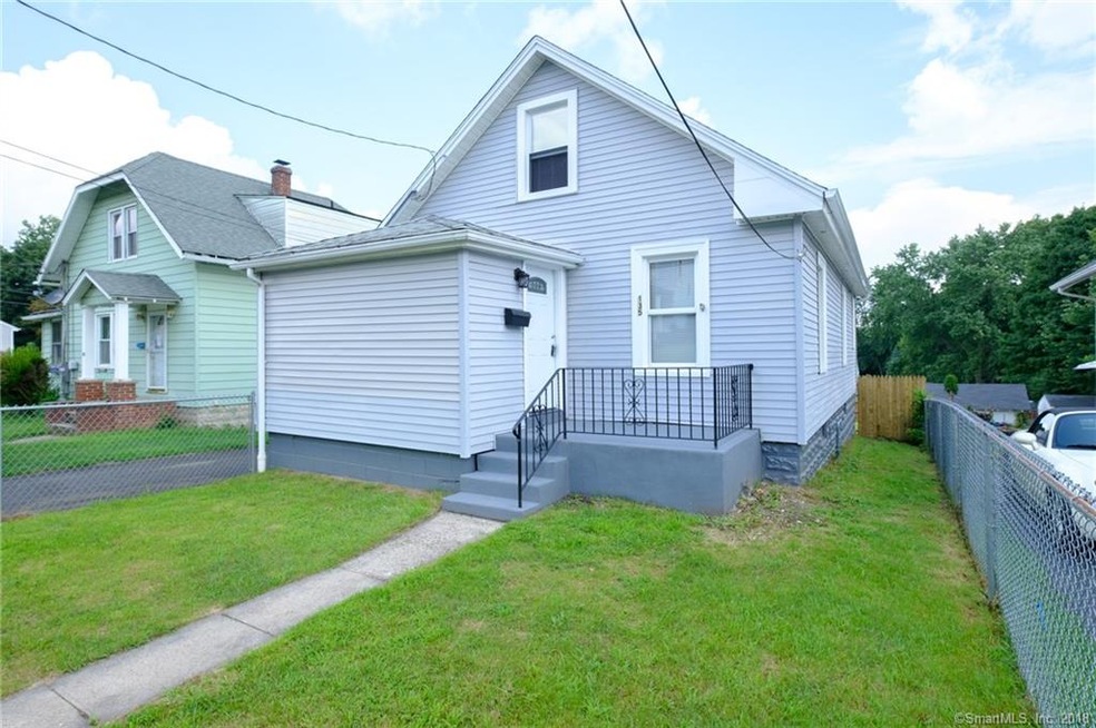 FRONT OF HOME WITH A FENCED IN YARD