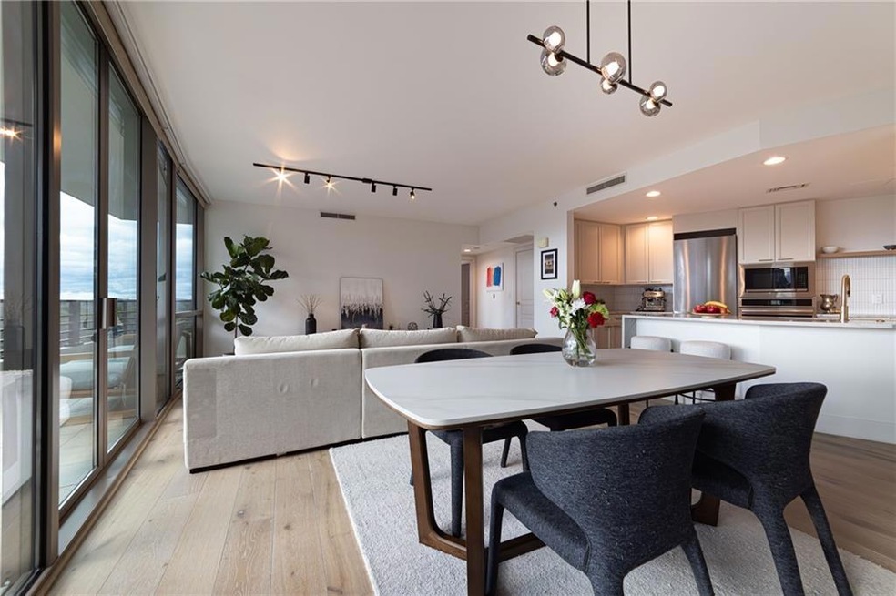 Dining area featuring a notable chandelier and lig