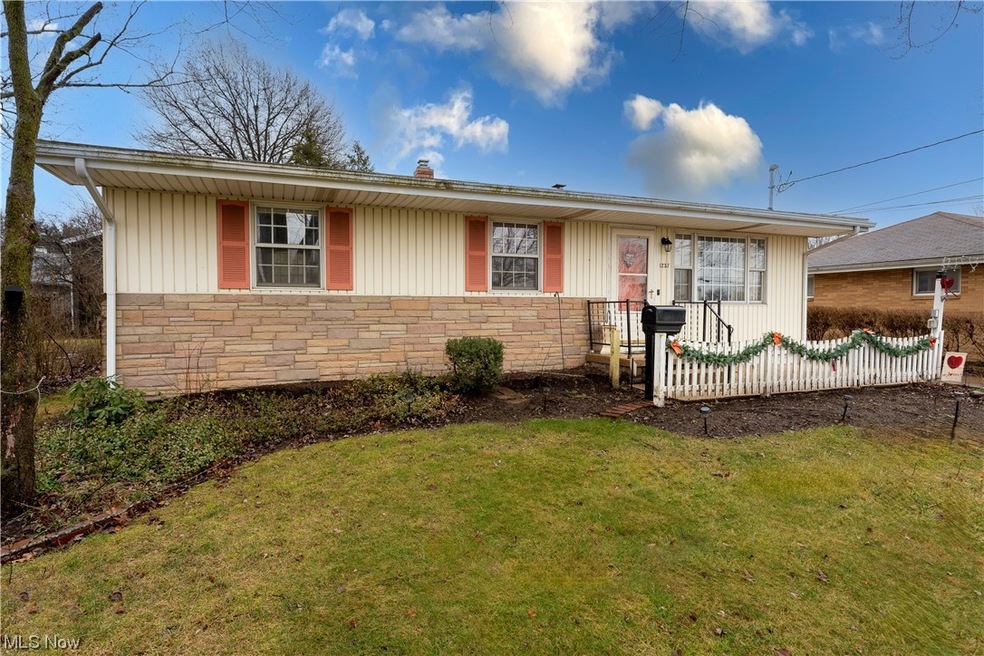 Single story home featuring a front yard