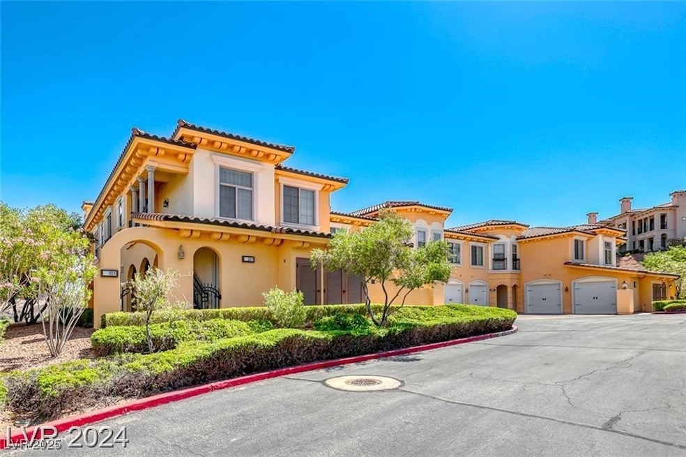 Mediterranean / spanish house with a garage, drive
