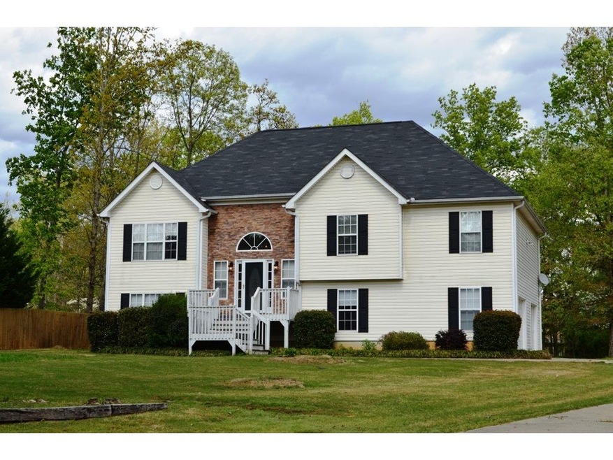 Large 4BR/3BA home on a .89 ac level lot!