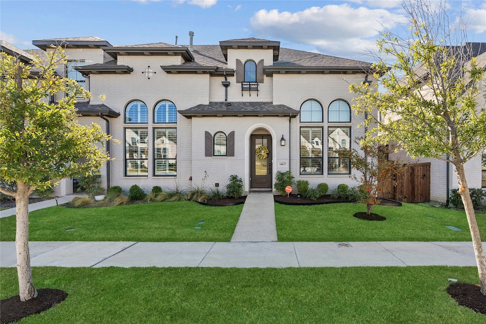 View of front of property with brick siding and a shingled roof