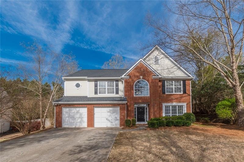 Easy maintenance home with brick front & concrete 