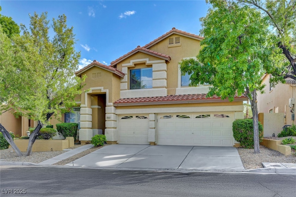 Mediterranean / spanish house featuring an attached garage, stucco siding, driveway, and a tile roof