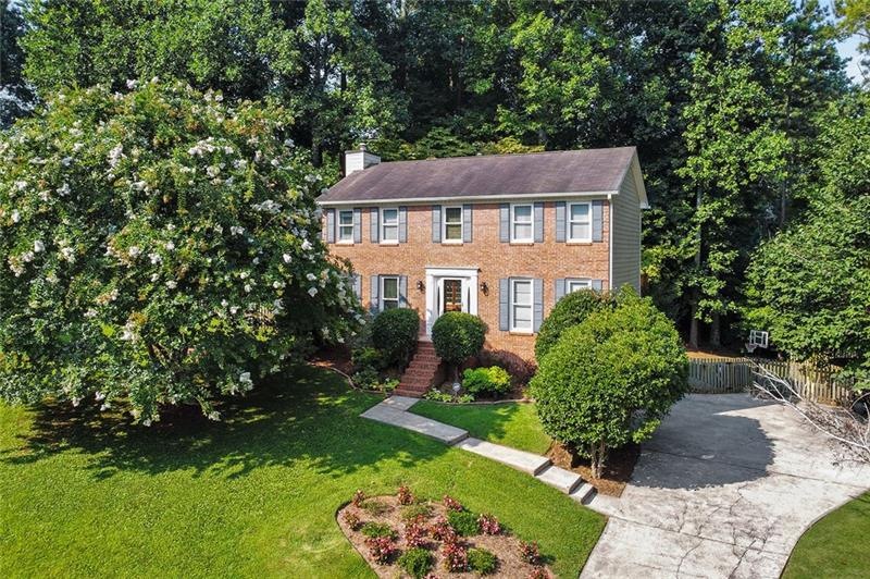 Gorgeous brick traditional nestled on a quiet cul-