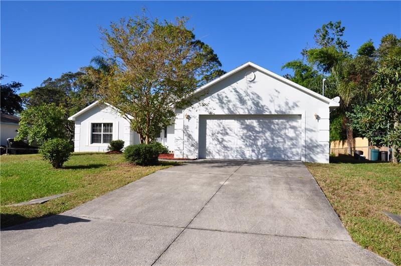 View from street, long driveway.