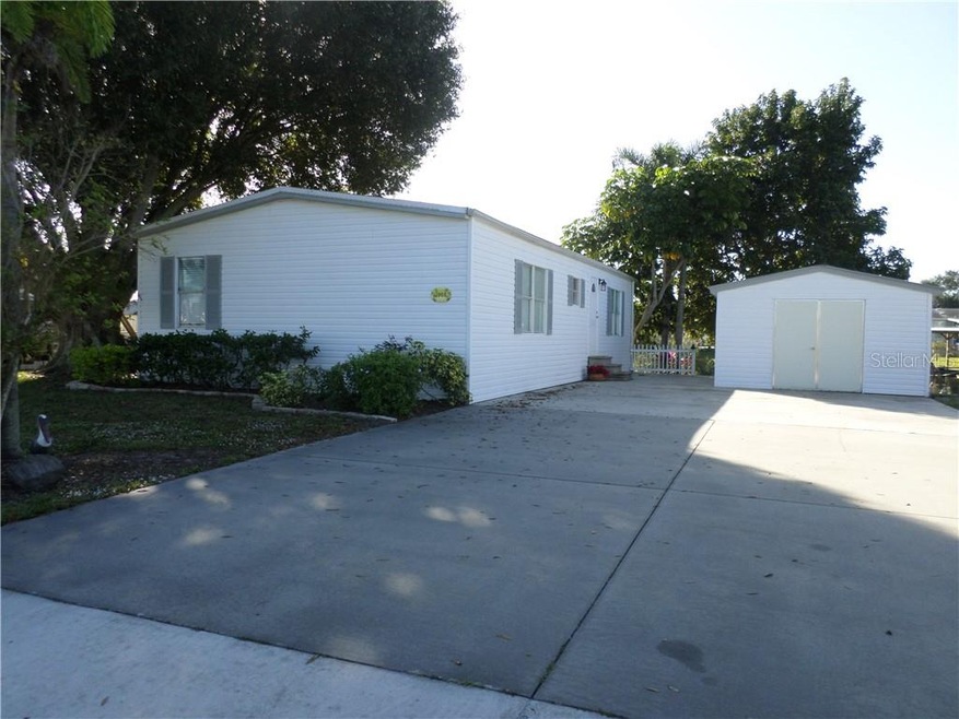 FRONT WITH LG. DRIVEWAY AND WORKSHOP