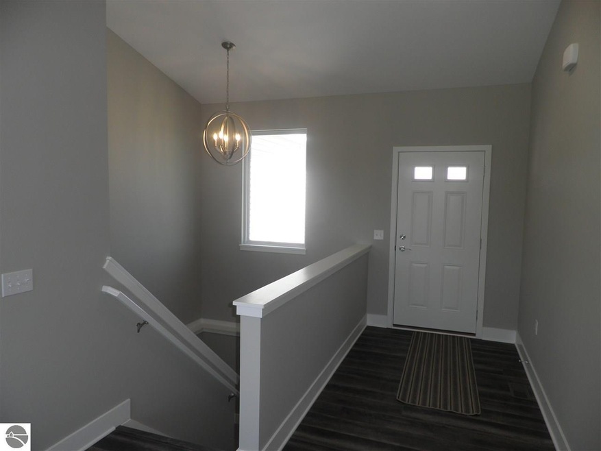 7556 E Meadows Dr unit 4, Cedar, MI 49621 - photo 1