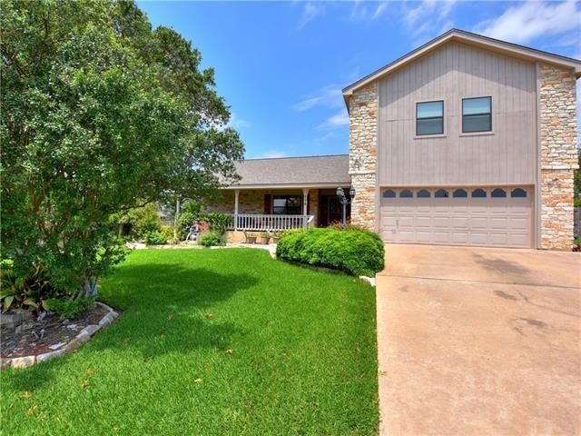 The home sits on a spacious lot with mature trees.