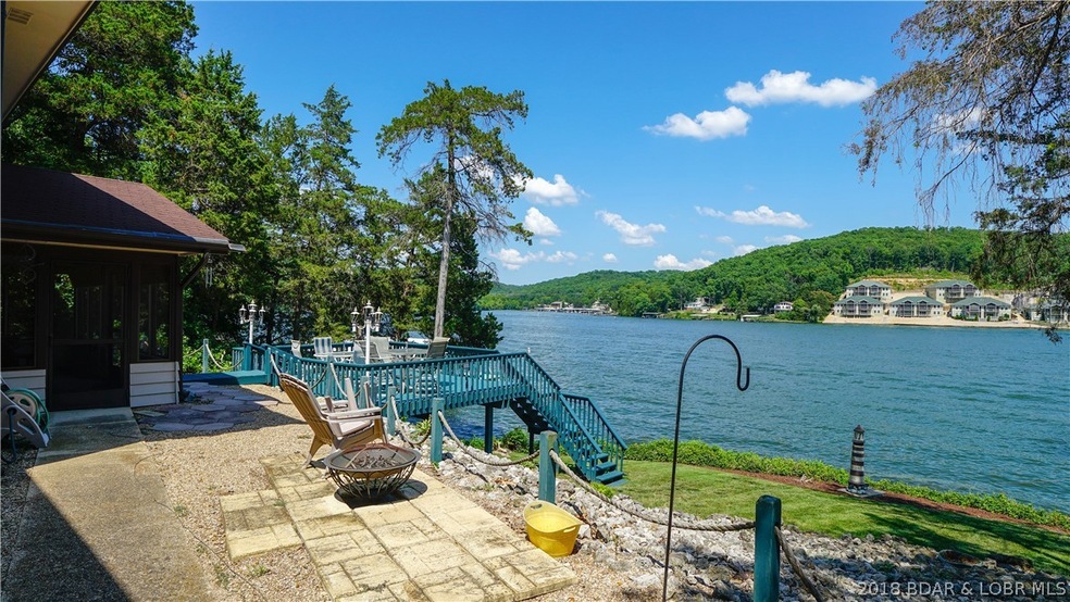 Side of house with deck and lake view!