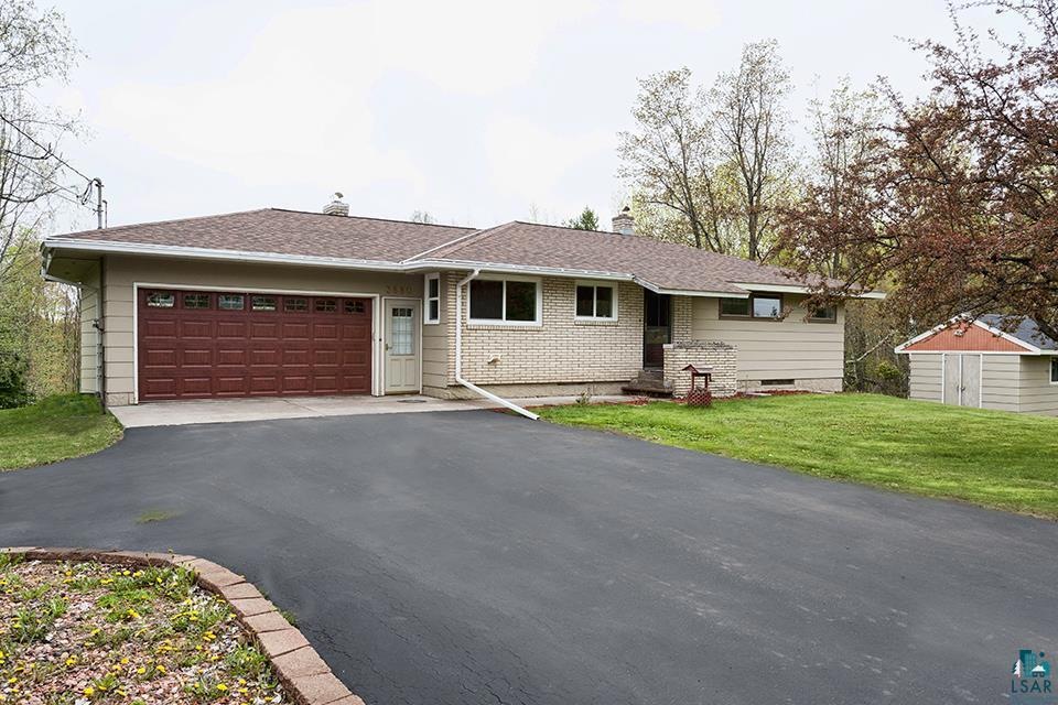 Walkout rambler located on beautiful acreage setti