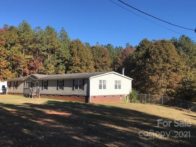Front view with fenced back yard.