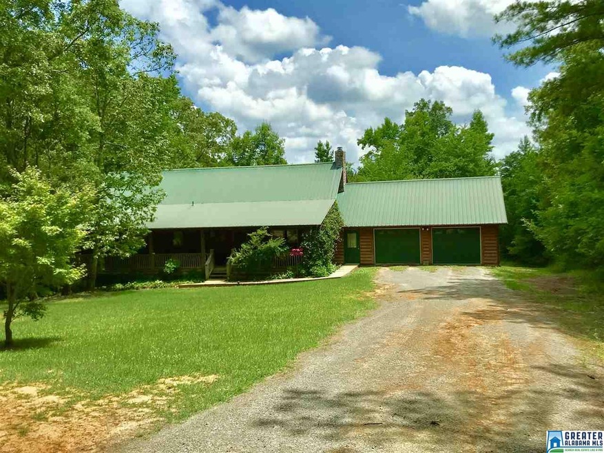 Beautiful Log home with metal roof. Covered front 