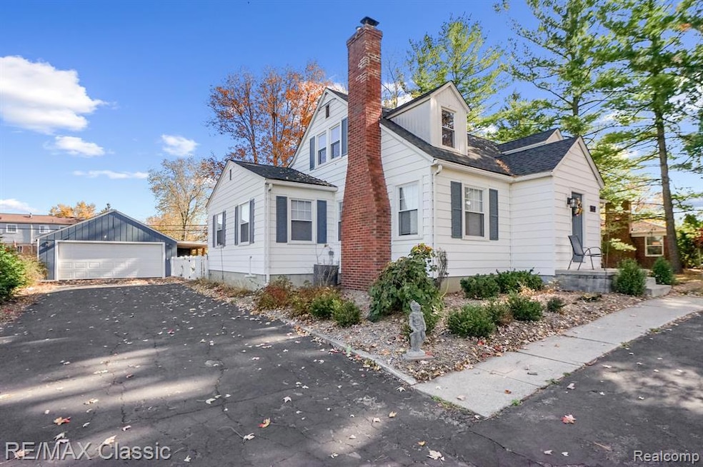 View of side of home with a garage