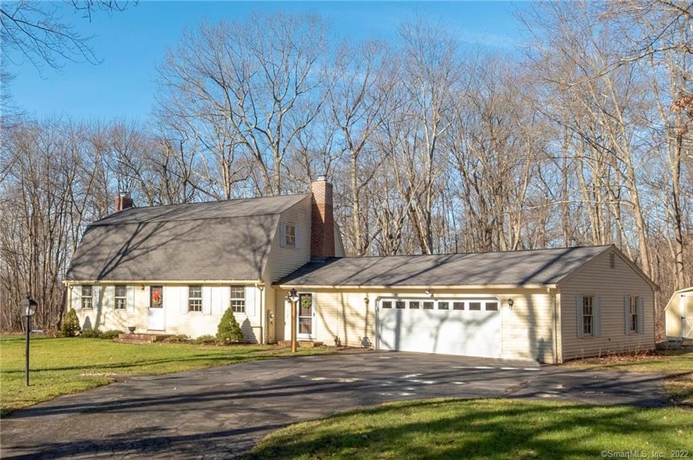 New England styled Dutch Colonial situated on a be