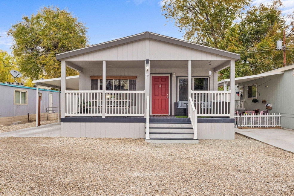 Manufactured / mobile home with covered porch and an attached carport