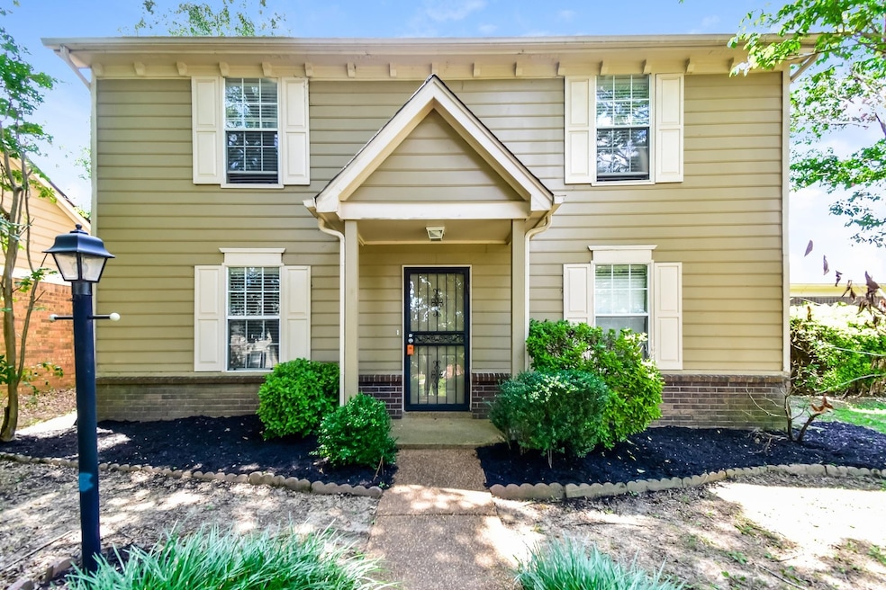 View of front of property with brick siding