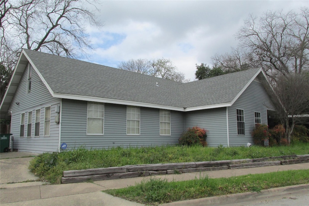View of front facade featuring roof with shingles
