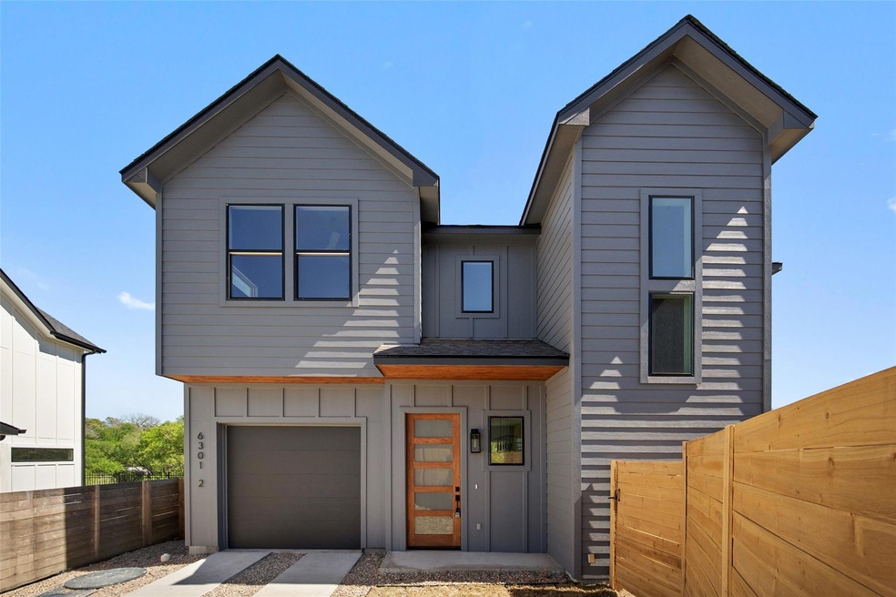 View of front of property featuring board and bat